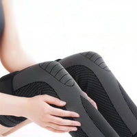 Lange elastische kniebrace met compressie en verwarmend effect